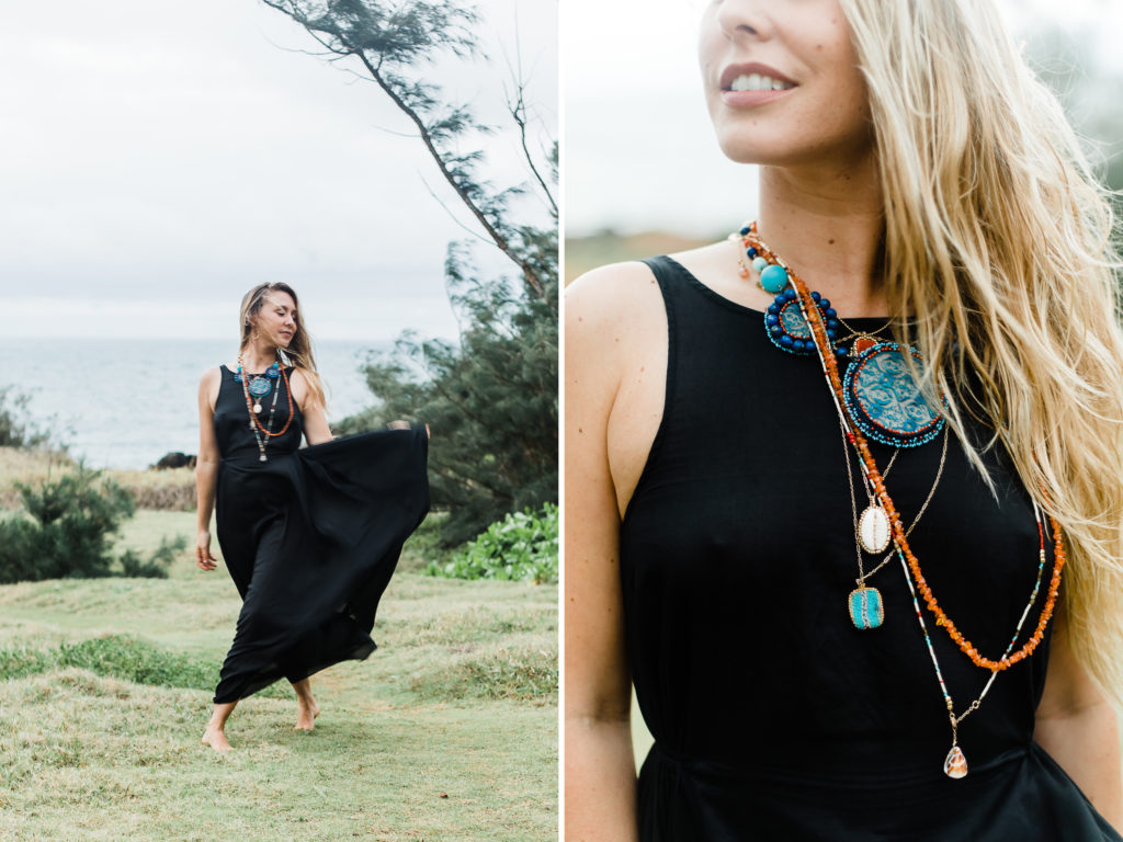 Beautiful woman in black dress with layers of handmade jewelry. 