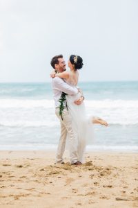 husband spinning bride at kauai beach wedding