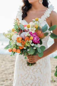bride holding colorful bridal bouquet
